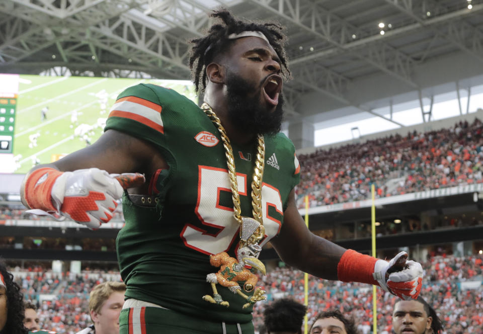 Miami linebacker Michael Pinckney celebrates with the turnover chain during the second half of an NCAA college football game against Florida State, Saturday, Oct. 6, 2018, in Miami Gardens, Fla. Miami won 28-27. (AP Photo/Lynne Sladky)