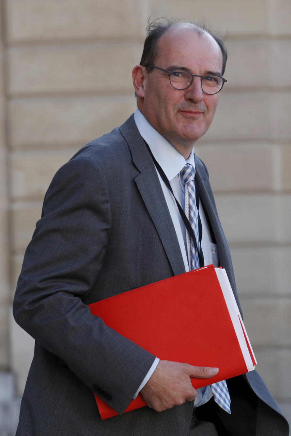 FILE - In this May 19, 2020 file photo, Jean Castex leaves after a videoconference with the French President and French mayors at the Elysee Palace in Paris. French President Emmanuel Macron has named Jean Castex, who coordinated France's virus reopening strategy, as new prime minister on Friday July 3, 2020. Emmanuel Macron is reshuffling the government to focus on reviving the economy after months of lockdown. (Gonzalo Fuentes/Pool via AP, File)