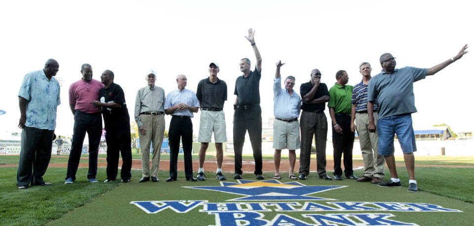 Members of the 1972 Olympic basketball team (from left) Jim Brewer, Mike Bantom, Tom Henderson, John Bach (asst. coach), Kenny Davis, Bobby Jones, Tom Burleson, Kevin Joyce, Jim Forbes, Ed Ratleff, John Brown (asst. coach) and Dwight Jones are introduced before the Lexington Legends baseball game at Whitaker Bank Ballpark in Lexington, Kentucky, Thursday, August 23, 2012. The team disputed a loss to the Soviet Union at the Munich Summer Olympics in 1972, and refused their silver medals. (Pablo Alcala/Lexington Herald-Leader/Tribune News Service via Getty Images)