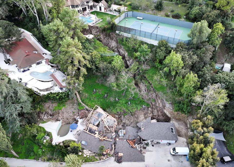 An aerial view shows a landslide which destroyed one home and damaged two others in the Sherman Oaks neighborhood on March 13, 2024 in Los Angeles, California.
