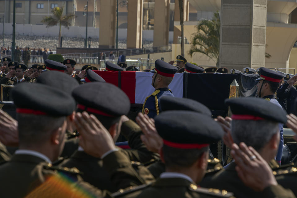 A horse-drawn carriage carries the flag-draped coffin of former autocratic President Hosni Mubarak during his funeral, at Tantawi Mosque, in eastern Cairo, Egypt, Wednesday, Feb. 26, 2020. Egypt is holding a full-honors military funeral for Mubarak who was ousted from power in the 2011 Arab Spring uprising. The 91-year-old Mubarak died on Tuesday at a Cairo military hospital from heart and kidney complications. (AP Photo/Hamada Elrasam)