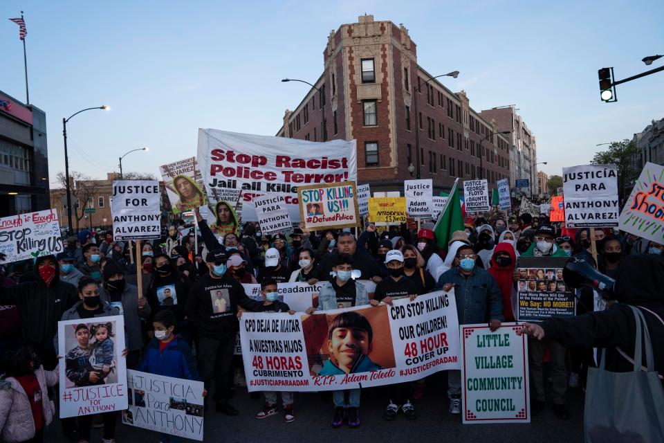 Community members protest the the fatal shooting of 13-year-old Adam Toledo by a Chicago officer Friday April 15, 2021 in Chicago's Logan Square neighborhood.