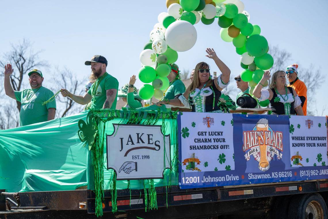 People waved from Jake’s Bar float as it drove along Johnson Drive during the 38th annual Shawnee St. Patrick’s Day Parade on Sunday, March 10, 2024, in downtown Shawnee.