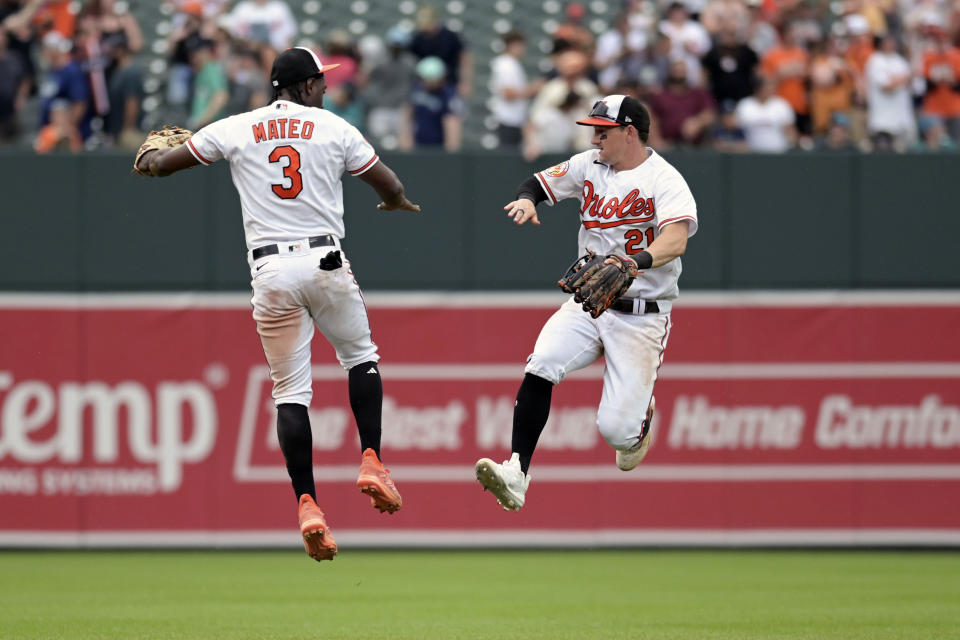 Baltimore Orioles' Jorge Mateo (3) and Austin Hays (21) celebrate after a baseball game against the Seattle Mariners, Sunday, June. 25, 2023, in Baltimore. (AP Photo/Tommy Gilligan)