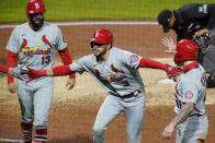 St. Louis Cardinals' Dylan Carlson celebrates as he heads to the dugout after hitting a three-run home run off Pittsburgh Pirates relief pitcher Chris Stratton during the sixth inning of the second baseball game of a doubleheader in Pittsburgh, Friday, Sept. 18, 2020. (AP Photo/Gene J. Puskar)