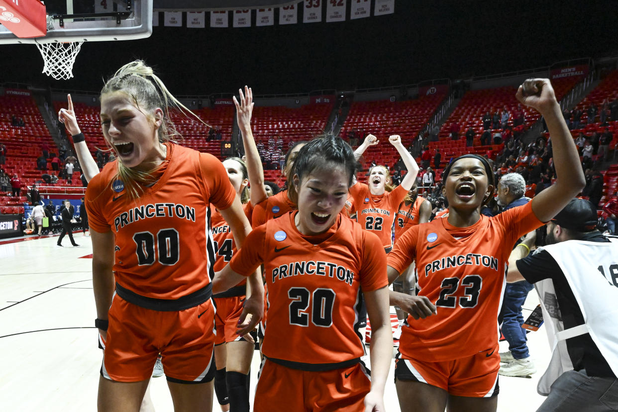 Princeton's Ellie Mitchell, Kaitlyn Chen and Madison St. Rose lead the Tigers' celebration after a 64-63 win over NC State during the first round of the NCAA women's tournament on March 17, 2023 in Salt Lake City. (Brett Wilhelm/NCAA Photos via Getty Images)