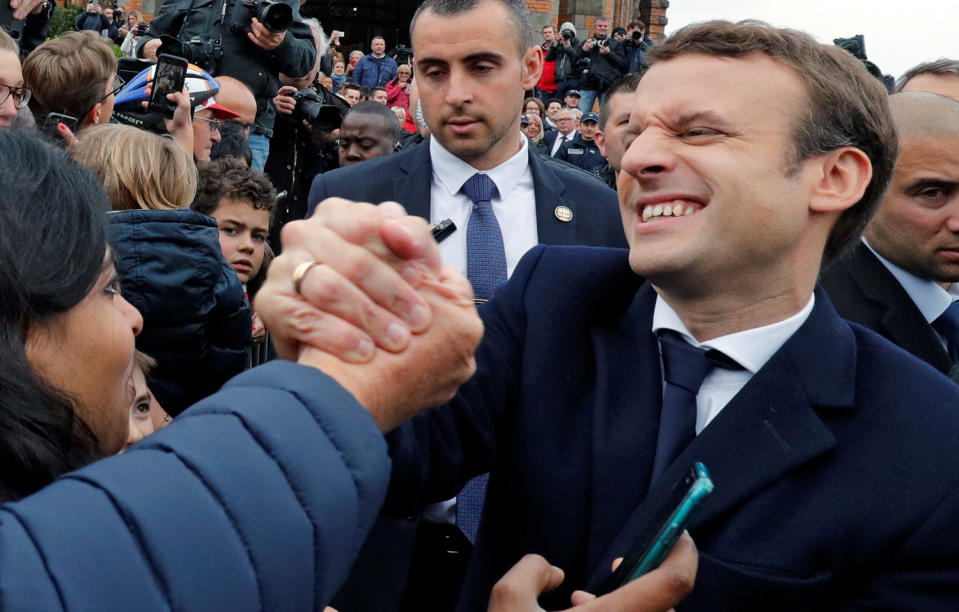 Emmanuel Macron greets supporters