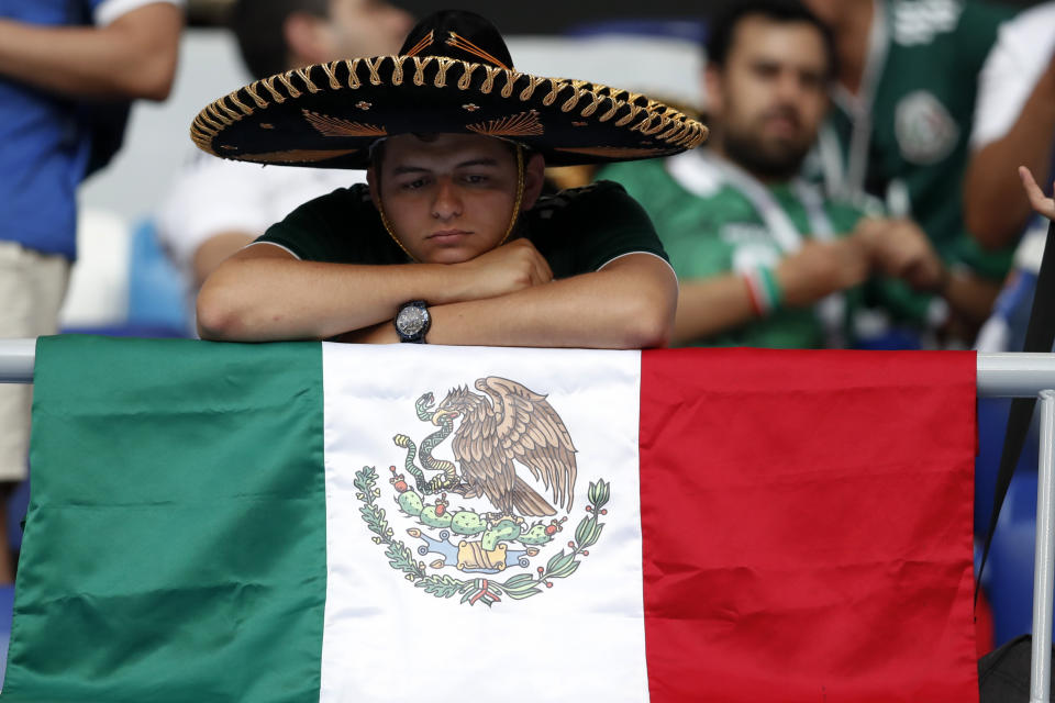 <p>A fan of Mexico sits on the stands after the round of 16 match between Brazil and Mexico at the 2018 soccer World Cup in the Samara Arena, in Samara, Russia, Monday, July 2, 2018. Mexico lost 0-2. (AP Photo/Eduardo Verdugo) </p>