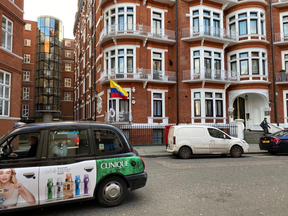 The Ecuadorean flag is seen on the balcony of the nation's embassy in London, on Feb. 11, 2020.