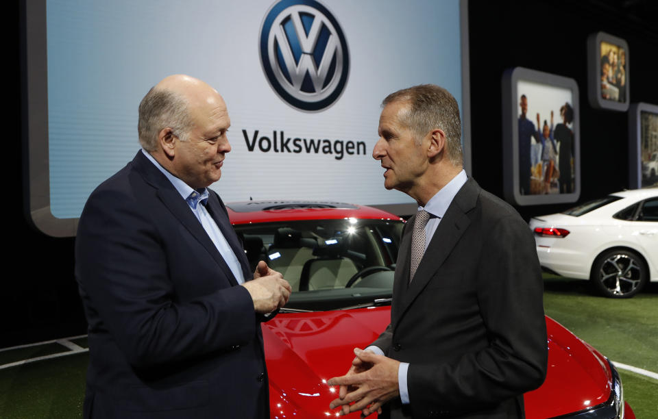 FILE - In this Jan. 14, 2019, file photo Ford Motor Co. President and CEO, Jim Hackett, left, meets with Dr. Herbert Diess, CEO of Volkswagen AG, at the North American International Auto Show in Detroit. Ford and Volkswagen are planning to unveil details about their budding alliance to build mobility services and autonomous and electric vehicles. Executives from both companies are planning to reveal details Friday, July 12. (AP Photo/Carlos Osorio, File)