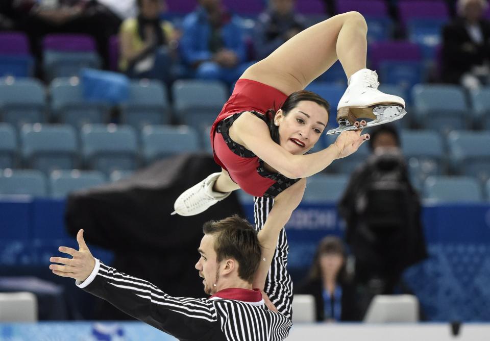 Kseria Stolbova and Fedor Klmovper from Russia perform their free program in the pairs event of the figure skating team event at the Iceberg Skating Palace during the 2014 Winter Olympics, Saturday, Feb. 8, 2014, in Sochi, Russia. (AP Photo/The Canadian Press, Paul Chiasson)