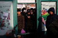 Security personnel take pictures of journalists waiting outside the courthouse where prominent rights lawyer Wang Quanzhang is being tried in Tianjin, China December 26, 2018. REUTERS/Thomas Peter