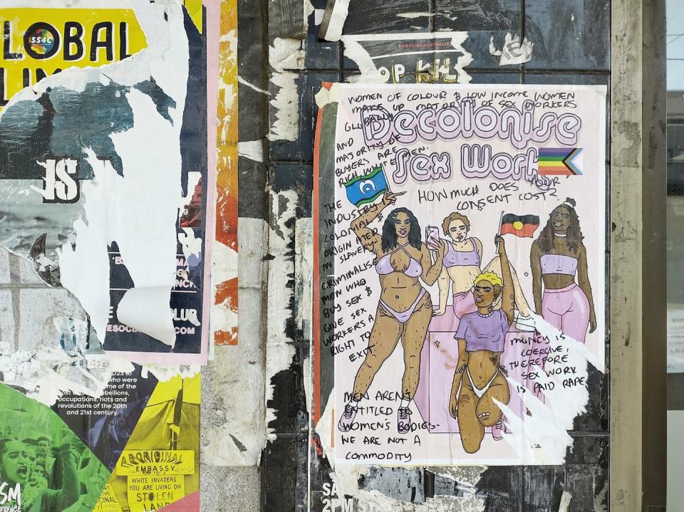 Urban walls are public forums. This poster depicts four women of different skin colours, with the Torres Strait Islander and Aboriginal flags and the message ‘Decolonise sex work’. The transgender flag is a later addition, along with the hand-written comments. Sabina Andron