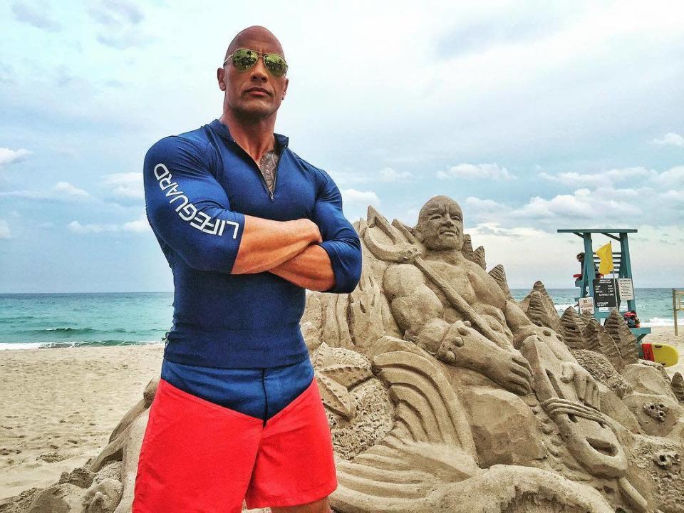 Enter Sandman (March 3) Johnson and an extremely ornate Mitch Buchannon sand sculpture. (Via @TheRock/Instagram)