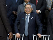 Bank of Japan Governor Haruhiko Kuroda smiles during the International Monetary Fund IMF Governors group photo a at the World Bank/IMF Annual Meetings in Washington, Saturday, Oct. 19, 2019. (AP Photo/Jose Luis Magana)