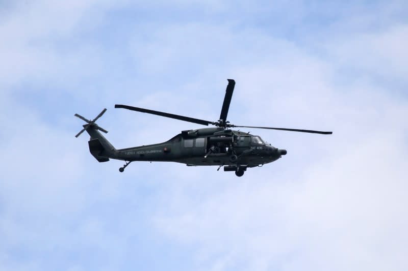 A military helicopter flies over a military battalion where a car bomb exploded, according to authorities, in Cucuta