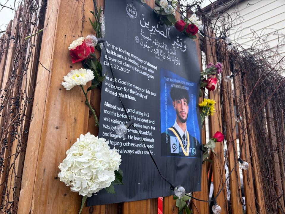 Flowers line a memorial for 17-year-old Ahmed Haitham Ahmed, one of two teens who died after falling through the ice on the Rideau River in Ottawa on Dec. 27, 2023.