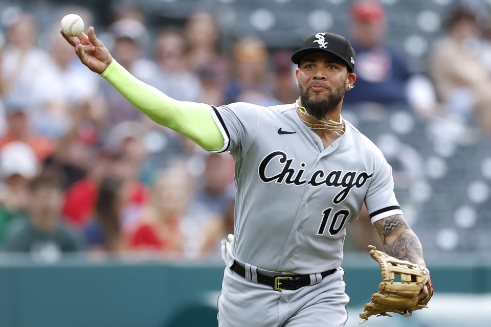 Chicago White Sox third baseman Yoan Moncada throws out Cleveland Guardians' Will Brennan at first base during the fifth inning of a baseball game, Tuesday, May 23, 2023, in Cleveland. (AP Photo/Ron Schwane)