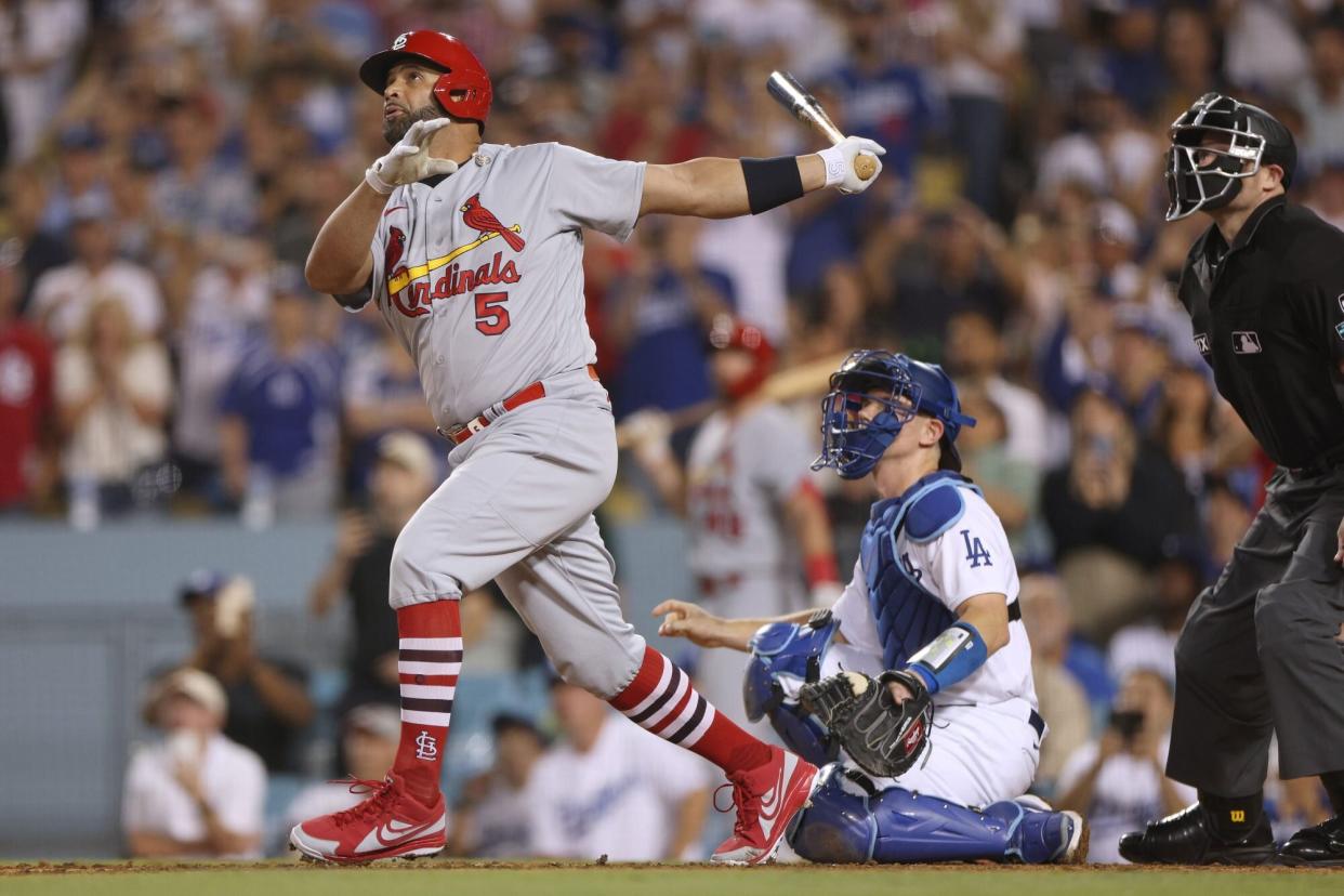 LOS ANGELES, CALIFORNIA - SEPTEMBER 23: Albert Pujols #5 of the St. Louis Cardinals watches his 700th career homerun with Will Smith #16 of the Los Angeles Dodgers, a three run homerun to take a 5-0 lead, during the fourth inning at Dodger Stadium on September 23, 2022 in Los Angeles, California. (Photo by Harry How/Getty Images)