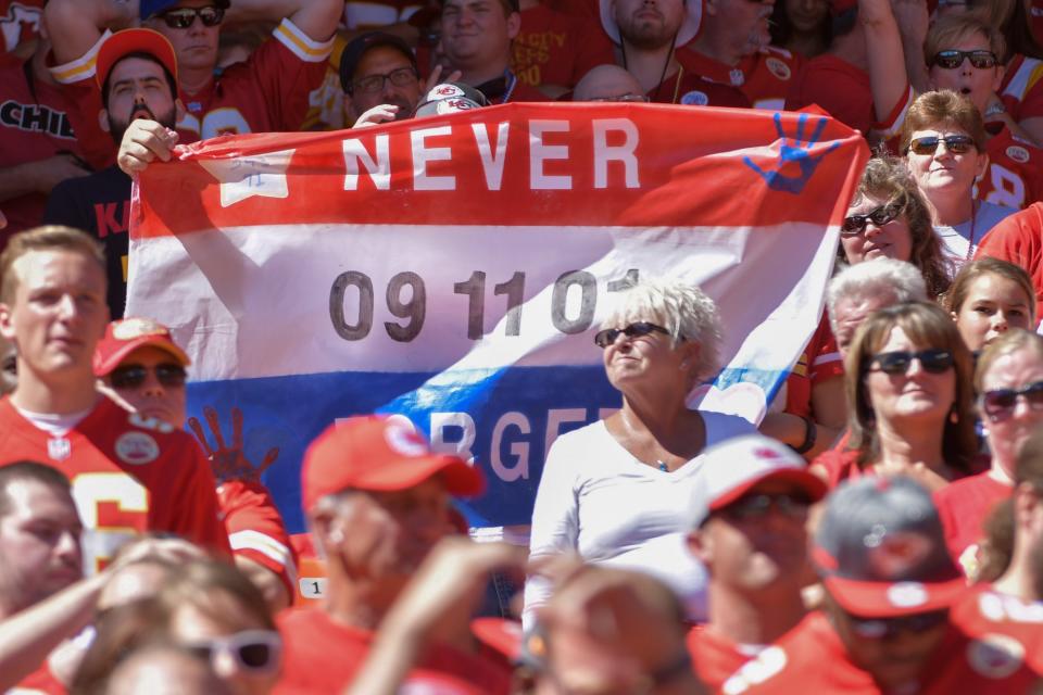 <p>A fan holds up a sign regarding 9/11 during the first half of the game against the San Diego Chargers at Arrowhead Stadium. Mandatory Credit: Denny Medley-USA TODAY Sports </p>