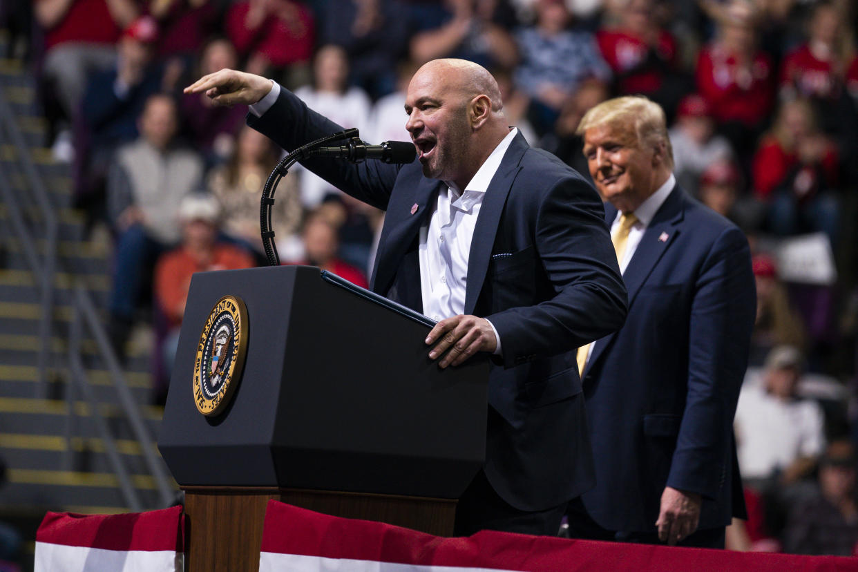 President Donald Trump looks on as UFC president Dana White speaks during a campaign rally at the Broadmoor World Arena on Thursday in Colorado Springs, Colo.