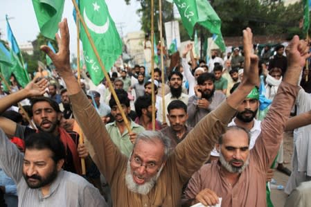 People chant slogans during a rally expressing solidarity with the people of Kashmir in Lahore