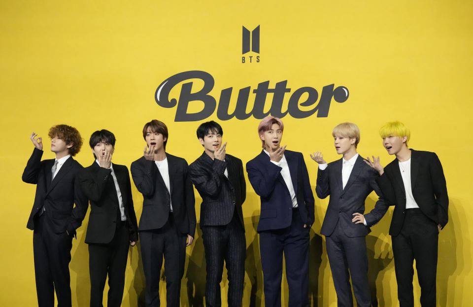 FILE- Members of South Korean K-pop band BTS, V, SUGA, JIN, Jung Kook, RM, Jimin, and j-hope from left to right, pose for photographers ahead of a press conference to introduce their new single "Butter" in Seoul, South Korea, Friday, May 21, 2021. South Korea has recently retaliated for North Korea's trash-carrying balloon launches with propaganda loudspeaker broadcasts at border areas. The South Korean broadcasts reportedly included K-pop sensation BTS’s mega hits like “Butter” and “Dynamite,” weather forecasts and news on Samsung as well as outside criticism on the North’s missile program. (AP Photo/Lee Jin-man, File)