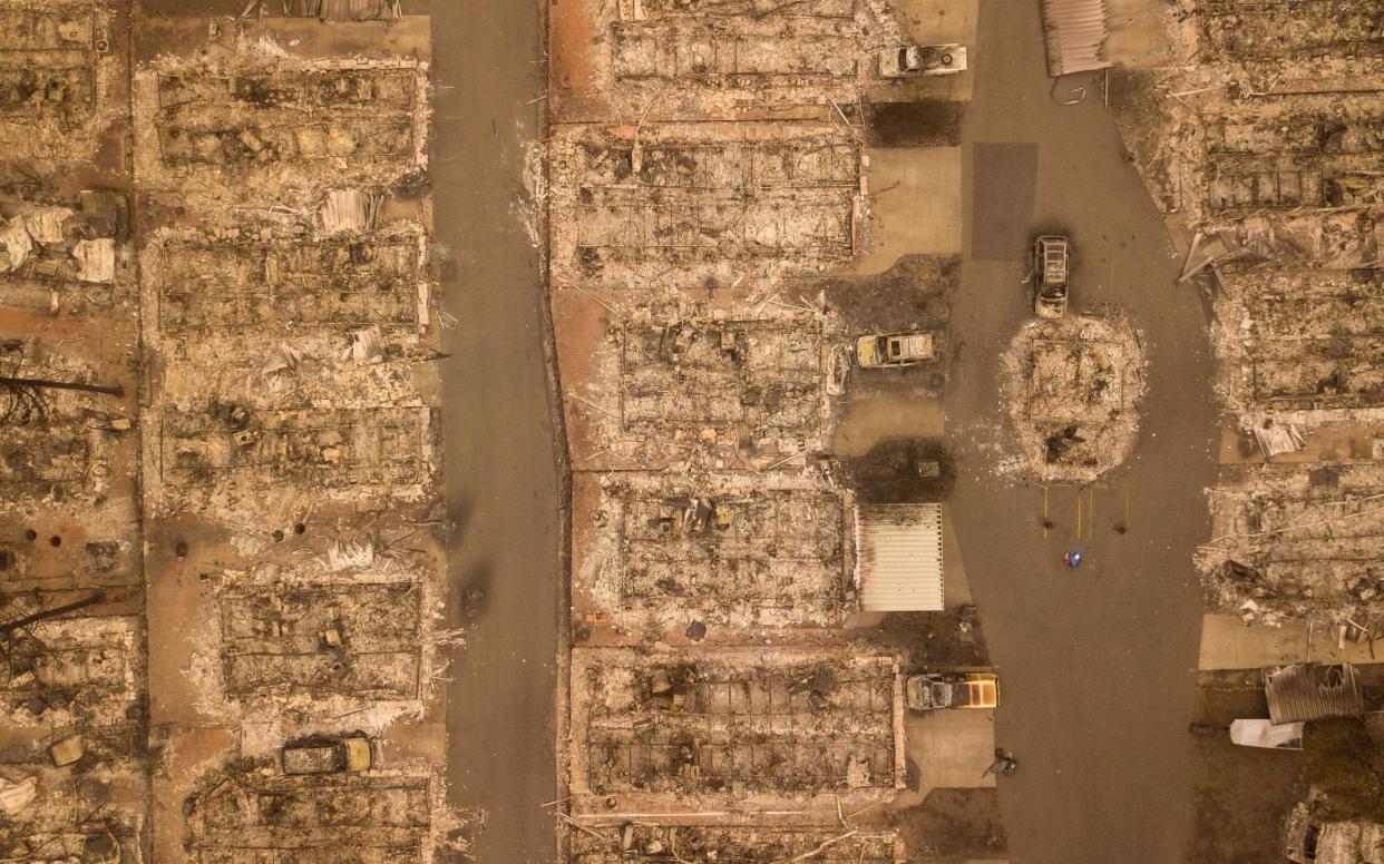 In this aerial photo, a burned neighborhood is seen in Paradise, California - AFP