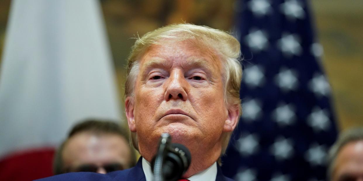 U.S. President Donald Trump responds to questions about the U.S. House impeachment investigation during a formal signing ceremony for the U.S.-Japan Trade Agreement at the White House in Washington, October 7, 2019.  REUTERS/Kevin Lamarque