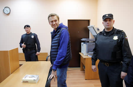 Russian opposition leader Alexei Navalny (C), who was detained over allegations of staging illegal protests, attends a court hearing in Moscow, Russia September 24, 2018. REUTERS/Maxim Shemetov