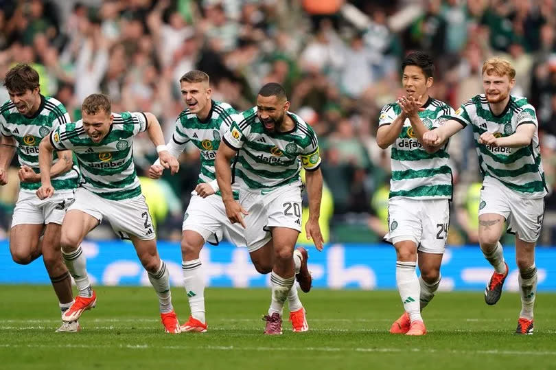 Celtic players celebrate winning the penalty shoot-out