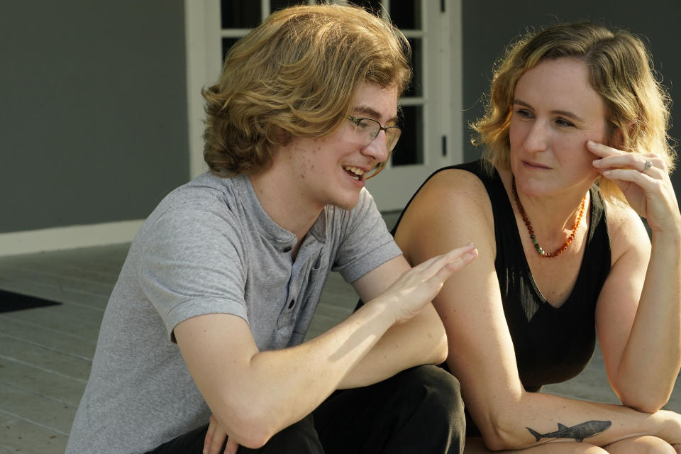 Ray Walker, 17, left, and his mother Katie Rives, discuss his moving to Virginia for continued gender-affirming care, Wednesday, June 28, 2023, in Madison County, Miss. This year, Republican Gov. Tate Reeves signed legislation banning gender-affirming care for anyone younger than 18. (AP Photo/Rogelio V. Solis)