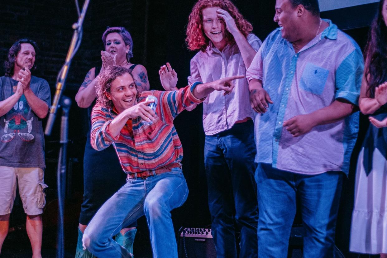 Songwriter Forrest McCurren motions during Heart of Missouri CASA's Voices of Columbia event June 16 at The Blue Note. McCurren was the winner of the event, raising $3,309.