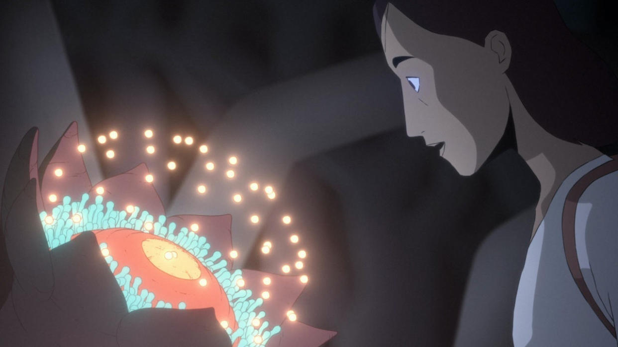  Ursula examines an alien flower in Scavengers Reign. 