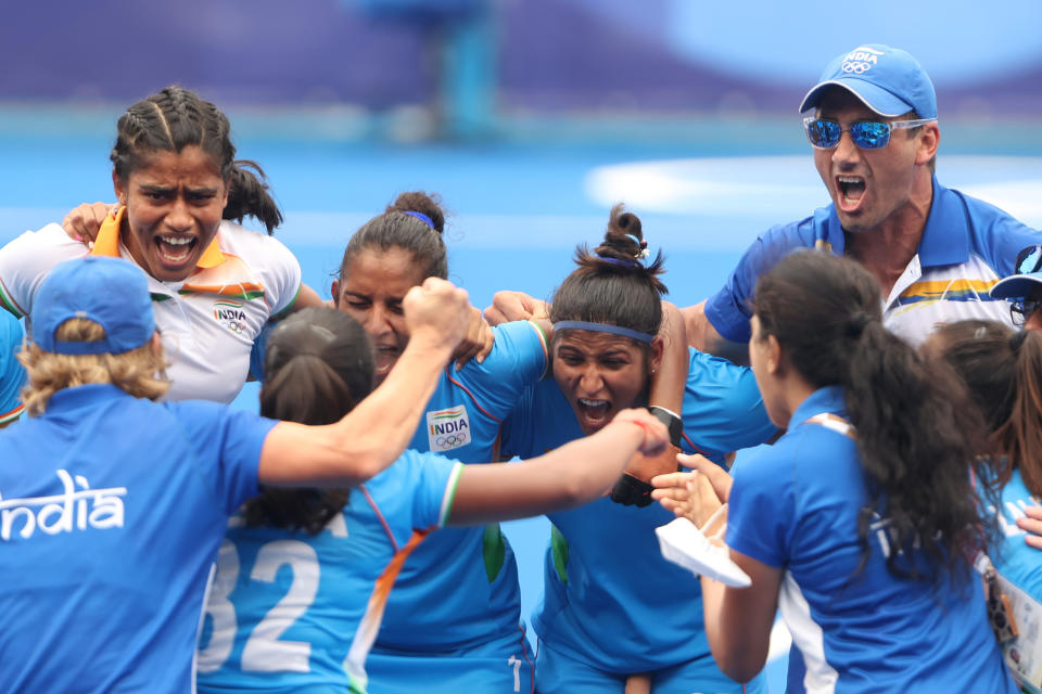 TOKYO, JAPAN - AUGUST 02: Navneet Kaur and Navjot Kaur (C) of Team India celebrate their 1-0 win with teammates after the Women's Quarterfinal match between Australia and India on day ten of the Tokyo 2020 Olympic Games at Oi Hockey Stadium on August 02, 2021 in Tokyo, Japan. (Photo by Alexander Hassenstein/Getty Images)