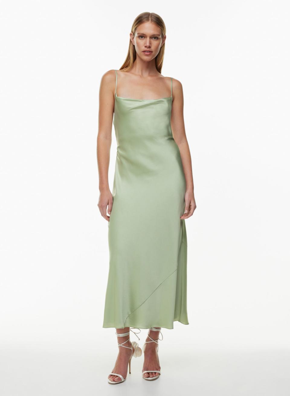 someone wearing the aritzia Ten Affection Satin Maxi Dress