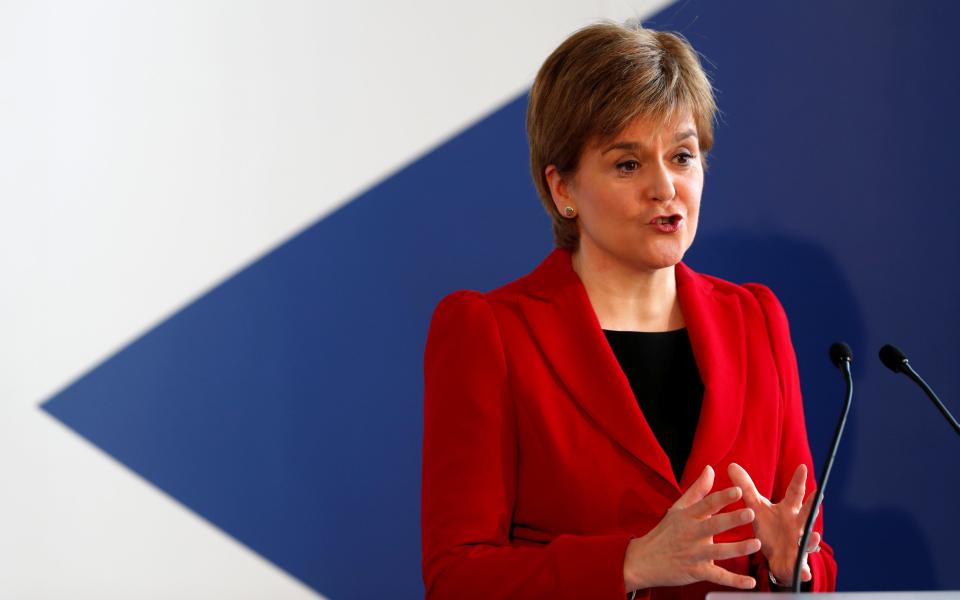 The First Minister is considering raising income tax - PA