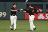 San Francisco Giants outfielders, from left, Alex Dickerson, Mauricio Dubon and Mike Yastrzemski celebrate at the end of a baseball game against the Arizona Diamondbacks on Saturday, Sept. 5, 2020, in San Francisco. San Francisco won 4-3. (AP Photo/Eric Risberg)