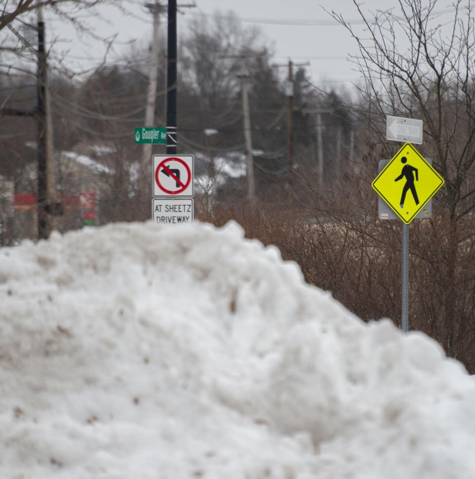 Kent sets out to clear sidewalks in the city limits and township. Gougler avenue.