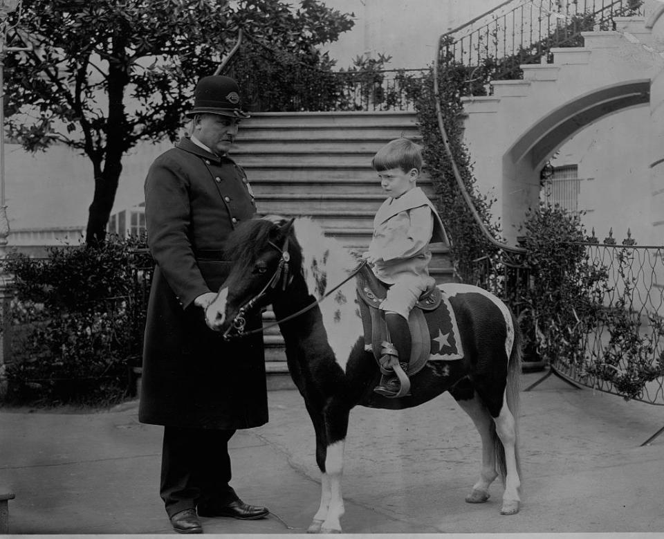 a boy on a small horse