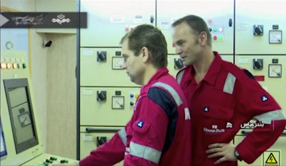 In this photo released by state-run IRIB News Agency, which aired on Monday, July 22, 2019, shows crew members of the British-flagged tanker Stena Impero, that was seized by Tehran in the Strait of Hormuz on Friday. The Associated Press cannot independently verify the condition of the crew members, but in the video they looked to be in good health and it didn't appear as though they were being filmed under duress. (IRIB News Agency via AP)