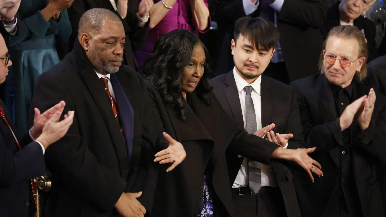 WASHINGTON, DC - FEBRUARY 07: Rodney Wells (2nd L) and RowVaughn Wells, step-father and mother of police murder victim Tyre Nichols, are applauded by Brandon Tsay (C), hero of the Monterey, California, shooting; Irish singer-songwriter Bono and others during U.S. President Joe Biden's State of the Union address in the House Chambers of the U.S. Capitol on February 07, 2023 in Washington, DC. The speech marks Biden's first address to the new Republican-controlled House.   Chip Somodevilla/Getty Images/AFP (Photo by CHIP SOMODEVILLA / GETTY IMAGES NORTH AMERICA / Getty Images via AFP)