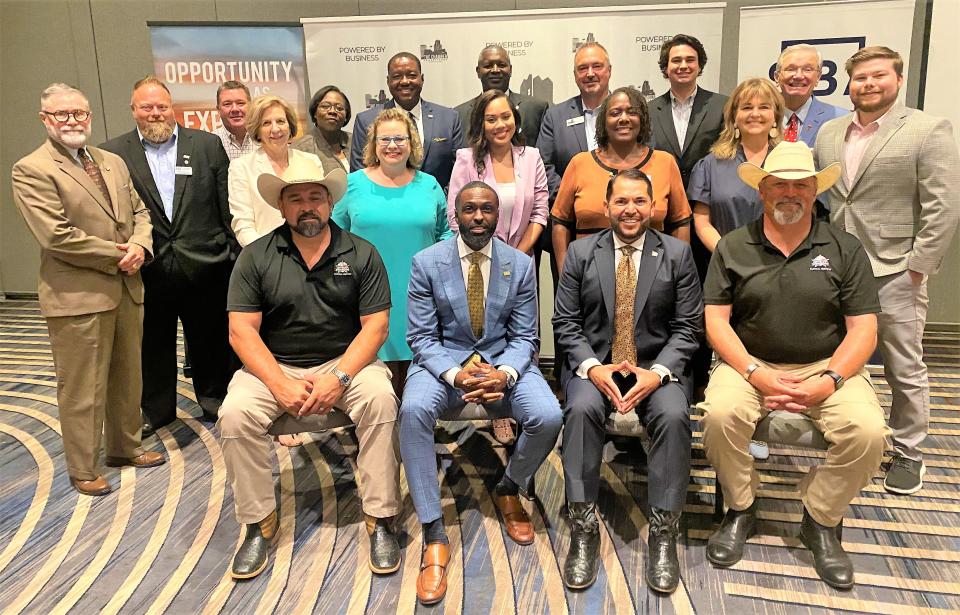 The group talking Abilene business Tuesday included Mark Madrid, a Small Business Administration official from Washington, D.C. (second from right, seated) and Ted James (to his right), SBA regional administrator for Region VI, which includes Abilene. Another visitor was Calvin Davis, district director for the Lubbock region (fifth from left, back row).