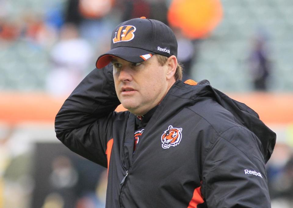 FILE - In this Jan. 1, 2012 file photo, Cincinnati Bengals offensive coordinator Jay Gruden walks on the field prior to an NFL football game against the Baltimore Ravens, in Cincinnati. Jay Gruden has agreed to become the head coach of the Washington Redskins. The Redskins confirmed Thursday, Jan. 9, 2014, that Gruden has accepted the job and will be introduced at an afternoon news conference. (AP Photo/Al Behrman, File)