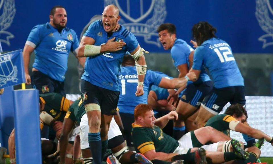 The Italy captain, Sergio Parisse, celebrates scoring during his side’s landmark win over South Africa in Florence.