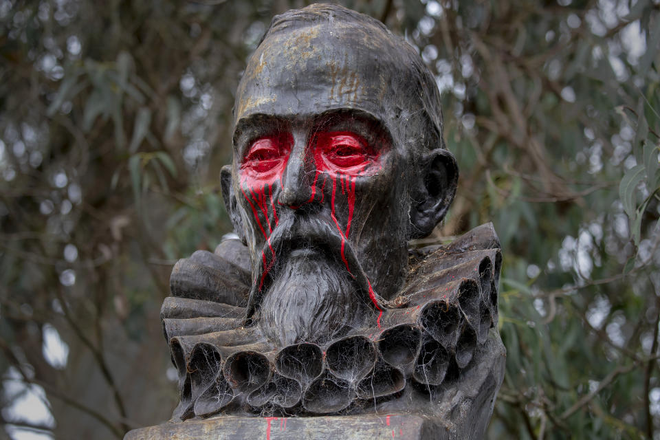 A statue of Spanish writer Miguel de Cervantes, author of "Don Quixote," stands after being vandalized overnight in Golden Gate Park in San Francisco, Saturday, June 20, 2020. (Karl Mondon/Bay Area News Group via AP)