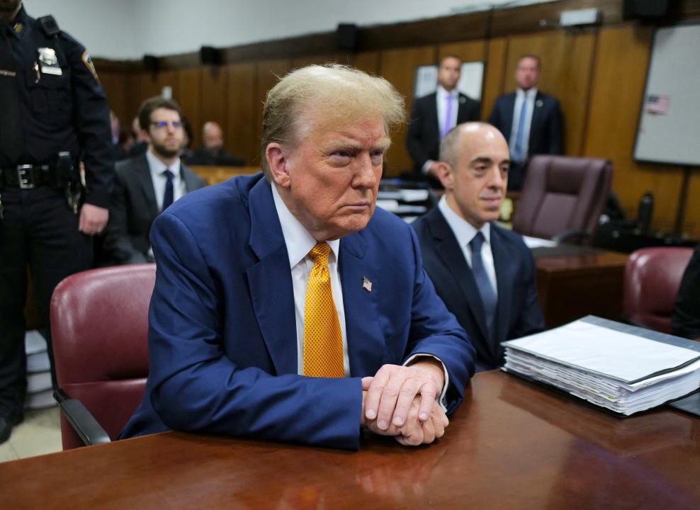 Donald Trump sits at the defense table before the start of his hush money trial.