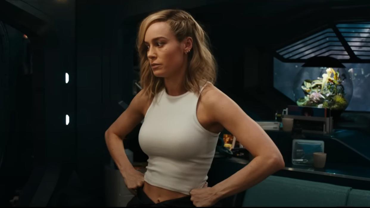  Brie Larson standing with her hands on her hips in The Marvels. 