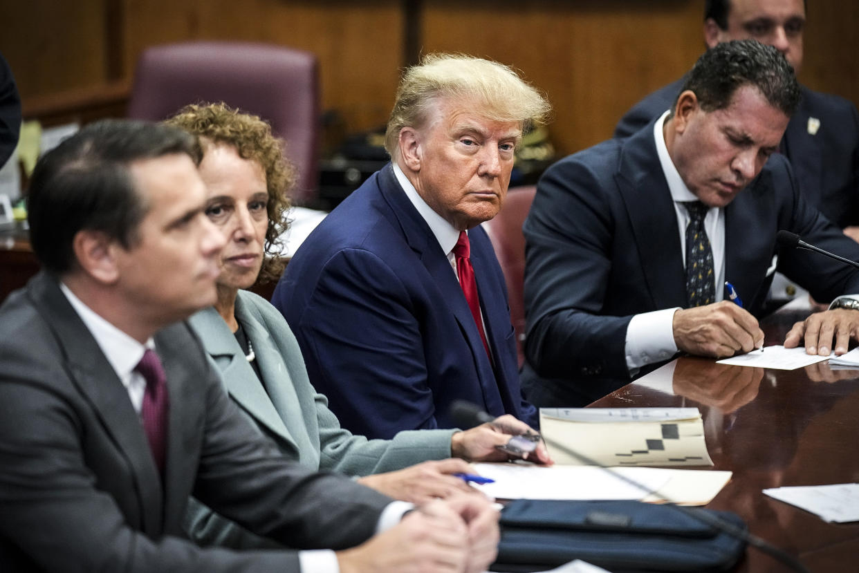 Image: Former President Donald Trump sits at the defense table with his defense team in a Manhattan court on April 4, 2023, in New York. (Seth Wenig / AP file)