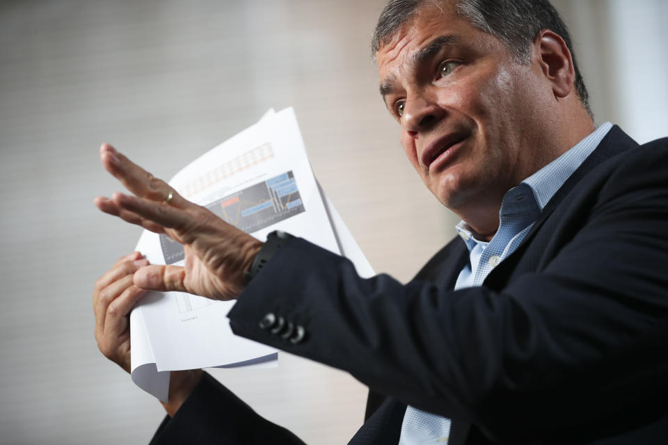Former Ecuador President Rafael Correa talks during an interview with Associated Press in Brussels, Thursday, Oct. 10, 2019. Correa is dismissing as "nonsense" allegations that he is plotting with Venezuela President Nicolas Maduro to destabilize the current Ecuador government amid violent unrest sparked by fuel price hikes. (AP Photo/Francisco Seco)